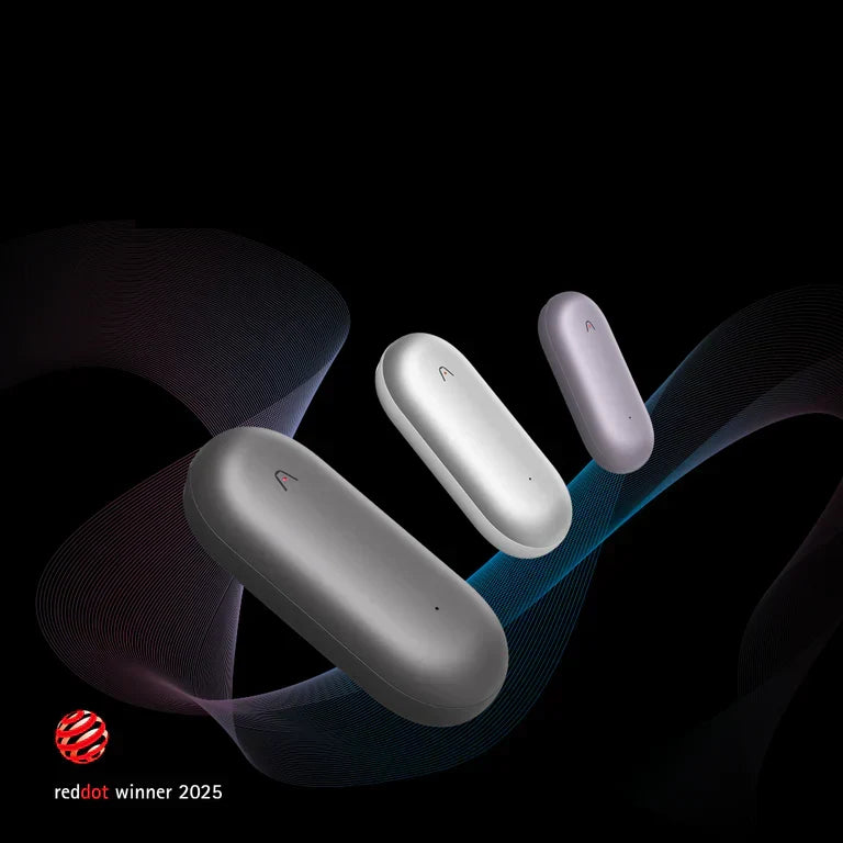 Three Plaud NotePin wearable recorders in gray, silver, and purple with the Red Dot Winner 2025 award logo.