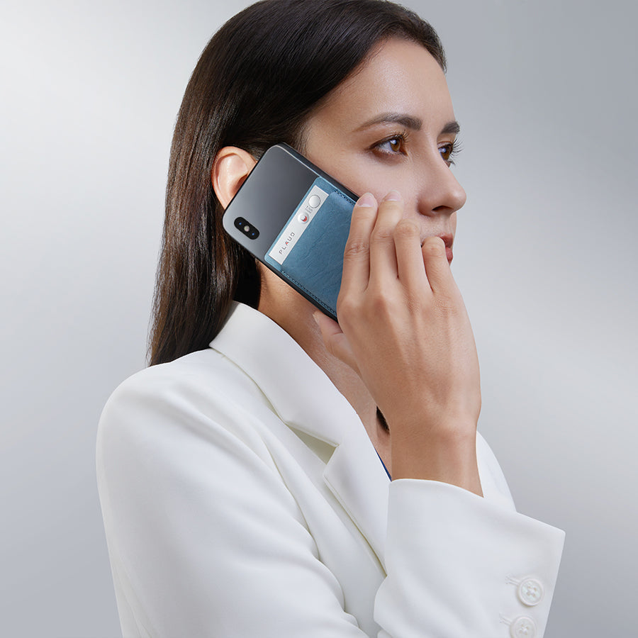 Woman using an Android smartphone, showing the device's back with an attachment