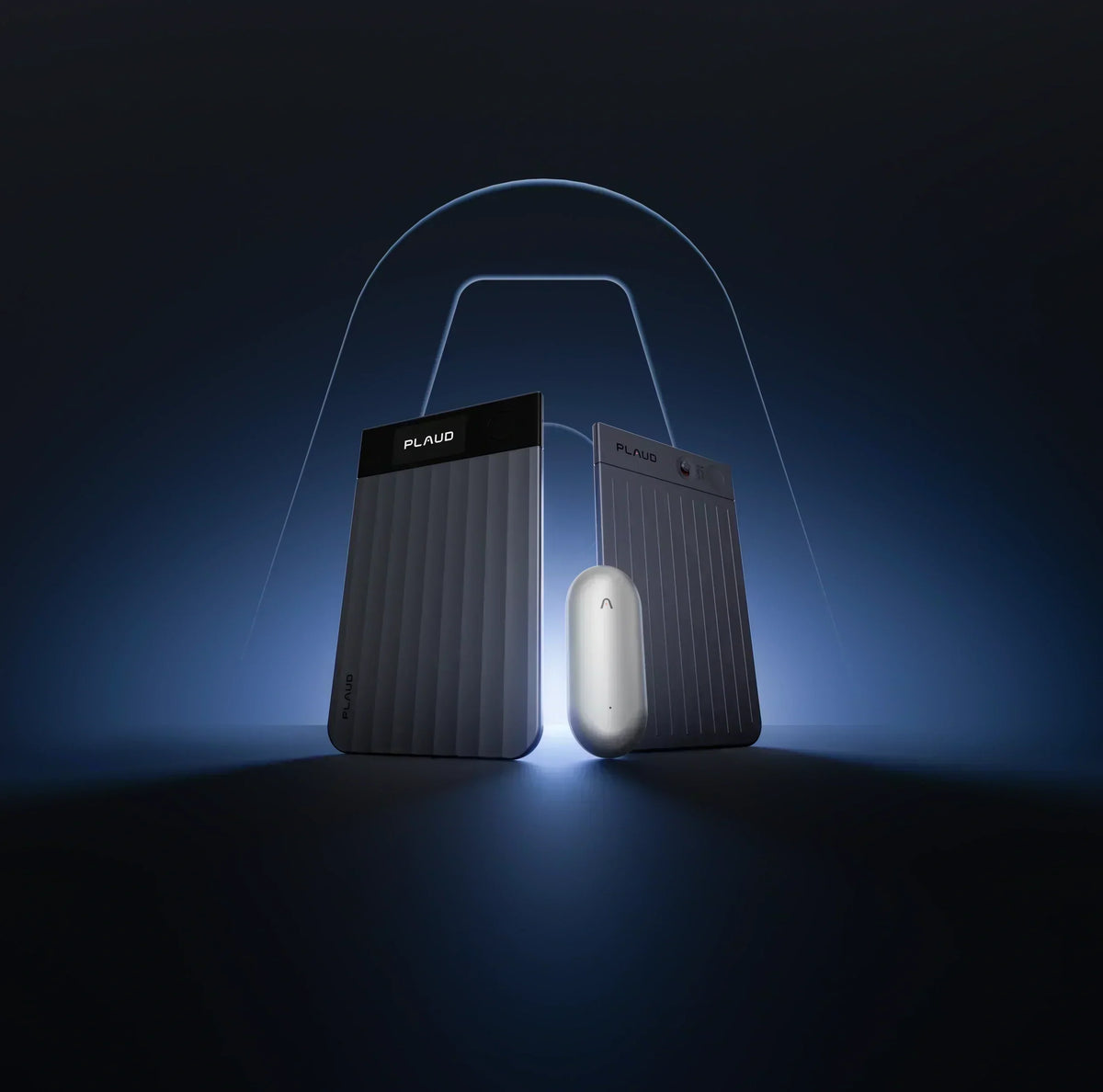 Black Plaud Note Pro with screen and ribbed texture next to a silver Plaud NotePin on a dark blue background.