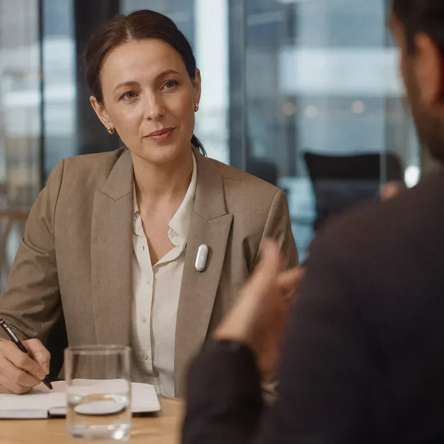Businesswoman taking notes during a discussion