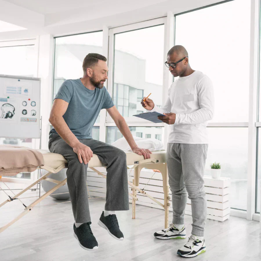 Doctor preparing consultation notes in clinic