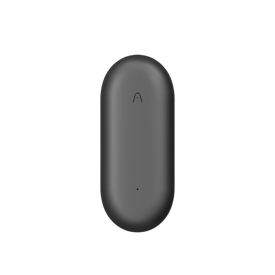 Plaud NotePin wearable AI voice recorder in sleek charcoal gray with minimalist oval design and subtle indicator light